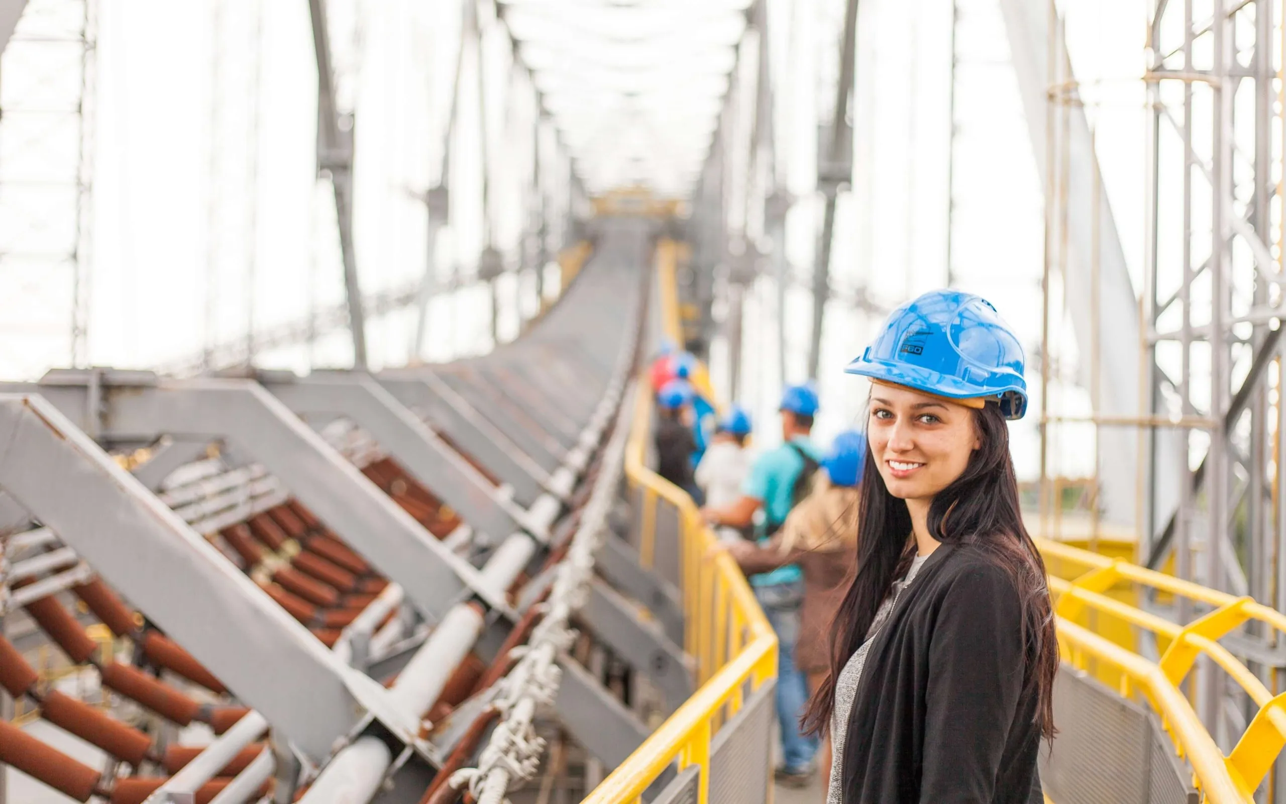 A site inspector in a hard hat on a construction site