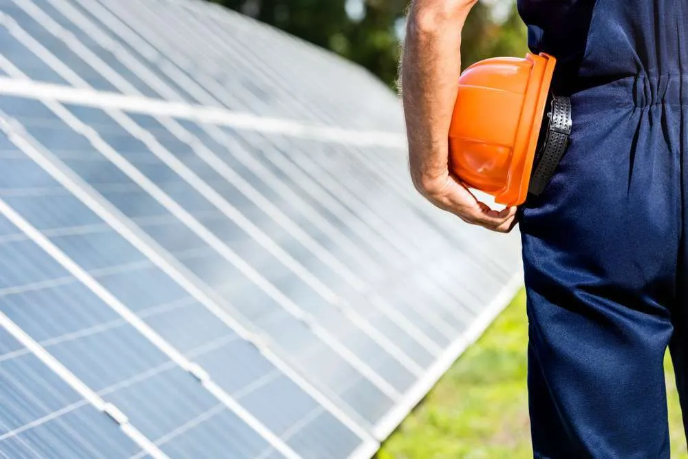 Rows of solar panels across a utility-scale solar farm