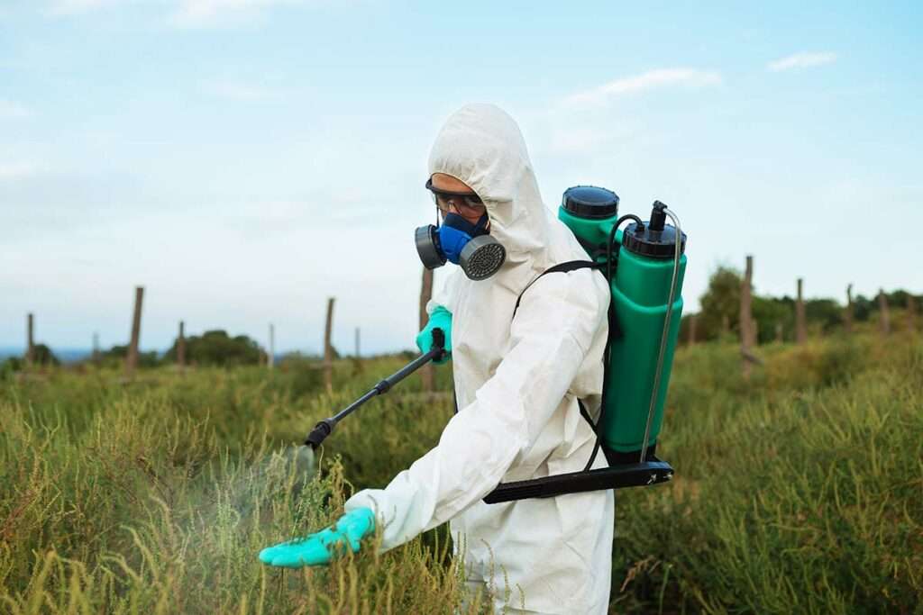 Man Wearing Safety Spraying