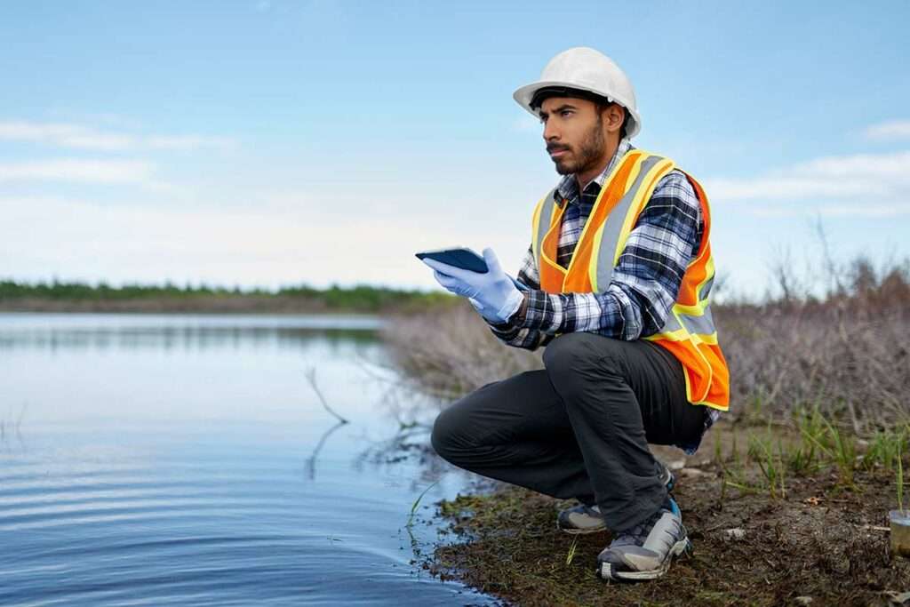 Man With Tablet Performing Water Test Results Environmental Assessment Inspection